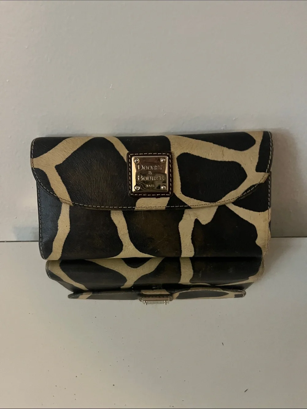 Dooney & Bourke Black and Cream Giraffe-Print Leather Clutch